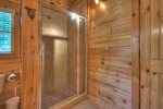 Loft master bathroom with a shower stall and jetted garden tub 